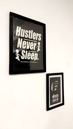 two black and white framed posters hanging on the wall next to each other, one with an ad for hustlers never sleep