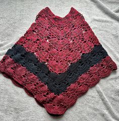 "Welcome to my Store.  Here I am offering a lovely handmade women's crochet poncho. This super soft yarn is a blend of 100% Worsted Acrylic Yarn and is completely machine washable.  You are buying the one in the first picture. This poncho has the perfect blend of colors for a brisk fall day with plays of burgundy and black. I used Caron and Lion Brand Yarn to make these ponchos (see pictures). The poncho is one size fits all. As you can see in the second picture of me wearing one it hits right near my upper thighs and I am 5'5\".  We can also customize color of poncho, just message me with details of color. Any questions please contact me.  Please check out my other items. More to come. All my items are prewashed and cleaned before shipping out. I will try to ship out all orders 7 business Handmade Yarn Poncho, One Size Crochet Patterns In Yarn, Crochet Yarn Shawl, One Size Crochet Yarn Shawl, One Size Yarn Poncho For The Beach, Cozy Handmade Poncho One Size, Handmade One Size Acrylic Yarn Poncho, Handmade Yarn Poncho One Size, Bohemian Crochet Poncho In Acrylic Yarn