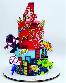 a spiderman themed birthday cake on a plate