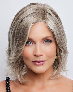 Kade by Noriko is a wavy ready-to-wear, soft layered style with face framing fringe. Kade features a 100% hand-tied, monofilament part with lace front cap construction offering a more natural appearance where the hair is parted. |  List Price: $479.00 |  Our Price: $368.00 |  FAST  FREE US Shipping |  Color Shown: Ice Blond |  Capsize: Average |  Cap Construction: Mono Part with Lace Front |  Fiber: Synthetic |  Length: Medium |  Weight: 3.5 oz. Part Hair, Light Blonde Highlights, Layered Style, Blonde Roots, Creamy Blonde, Monofilament Wigs, Hair Toppers, Natural Hair Growth, Hair Fibers