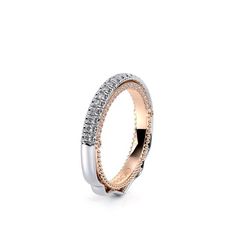 two tone gold and silver wedding ring with diamonds on the inside, set against a white background