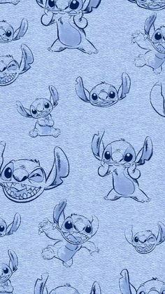 an image of stitch and stitch characters on blue fabric