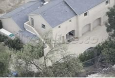 an aerial view of a house in the hills