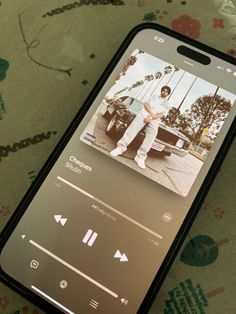 an iphone with the music player on it