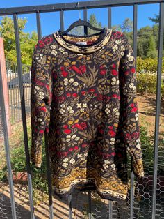 Super slouchy, long sleeve, knitted sweater that is perfect for the Fall & Winter weather.  Amazing floral & foliage pattern throughout in hues of olive green, marigold, cherry, cream, and ebony.  A soft & cozy sweater that looks great over a slip dress or maxi skirt. In great vintage condition.  No stains or holes to note, only few loose threads that are barely visible. Tag says: L/fits true to size Label: Land's End Foliage Print, Floral Foliage, Land's End, 90s Floral, Long Sleeve Knit Sweaters, Winter Weather, Cozy Sweater, Size Label, Cozy Sweaters