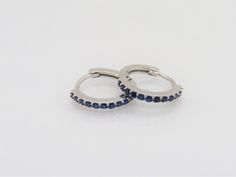 Vintage Sterling Silver Blue Sapphire Hoop Earrings ...Marked 925...Total of weights 1.6grams...Measure H 13.4MM W 1.7MM...These are in very good condition. Small Blue Sterling Silver Hoop Earrings, Blue Sterling Silver Huggie Earrings, Blue Sterling Silver Round Huggie Earrings, Blue Small Hoop Huggie Earrings In Sterling Silver, Blue Hypoallergenic Sterling Silver Huggie Earrings, Sapphire Earrings, Earrings Photo, Star Earrings, Vintage Sterling Silver