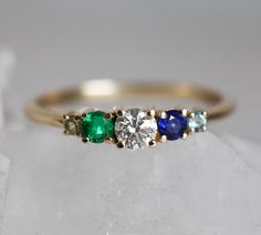 Cluster diamond, sapphire, emerald ring. Same design can be replicated with other gemstones per request. Item info: - main stone - 0.25ct diamond with GIA certificate, F to G color, VS clarity - 4mm diamond - side stones, top quality emerald and sapphire, peridot - emerald and blue sapphire 3mm - 14k/18k gold - please choose metal option and ring size from the drop down menu. ★ ★ ★ ★ ★ ★ ★ ★ ★ Enter my shop here: Click here to visit Capucinne shop: http://www.etsy.com/shop/capucinne Thanks for v Sapphire And Emerald Engagement Ring, Green Diamond Multi-stone Birthstone Ring, Green Diamond Birthstone Ring With Multi-stone, Sapphire Multi-stone Diamond Promise Ring, Emerald Multi-stone Round Cut Ring, Multi-stone Round Cut Emerald Ring, Diamond And Sapphire Ring For May Birthstone, Sapphire Ring With Diamond For May Birthstone, Round Cut Multi-stone Emerald Ring