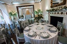 a table set up with place settings and silverware for an elegant wedding reception at the inn