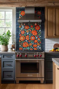 a kitchen with an oven, stove and counter top covered in colorful wallpapers