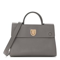 This is an authentic CHRISTIAN DIOR Bullcalf Medium Diorever Flap in Meteorite Grey. This chic handbagis composed of bull calfskin leather in grey. This handbag features rolled leather top handles, an optional shoulder strap, and polished gold hardware. The front facing flap opens with a texturedmagnetic press lock to a lovely grey suede leather interior with patch pockets. Luxury Gray Bag With Palladium Hardware, Luxury Gray Shoulder Bag With Palladium Hardware, Luxury Gray Top Handle Satchel, Gray Leather Top Handle Satchel, Lovely Grey, Grey Suede, Chic Handbags, Gray Suede, Leather Interior