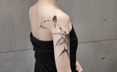 a woman with a tattoo on her arm