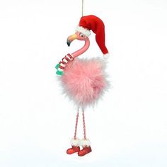 a pink flamingo ornament with a santa hat on it's head