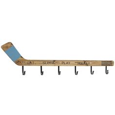 a wooden hockey stick mounted to a wall