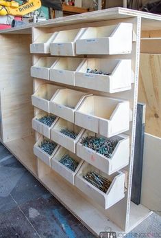 the shelves are filled with many different types of screws and nails in bins