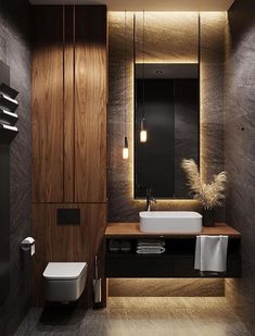 a modern bathroom with dark wood and white fixtures