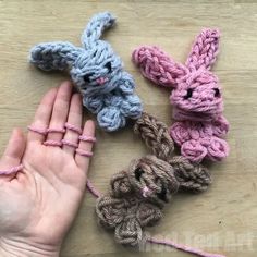 there are four crocheted bunnies on the table