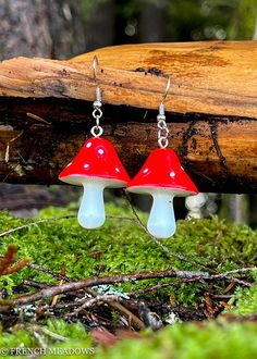 These little red mushroom dangle earrings celebrate the most iconic mushroom of all: amanita muscaria! These earrings have bright red mushroom caps with white spots and white stems. These earrings would be a perfect addition to Goblin Core or Cottage Core outfits, or a great gift to any nature loving friend or faerie.Each earring measures 1 1/4" long by 1" wide Mushroom Cosplay, Mushroom Designs, Red And White Mushroom, Amanita Mushroom, Mushroom Caps, White Mushroom, Fairy Witch, Fairy Cosplay, Cottage Core Style