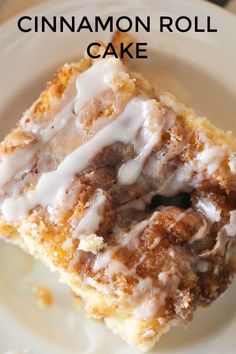 cinnamon roll cake on a white plate with the title in the middle overlaying it