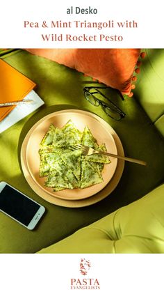 a plate with some food on top of it next to a cell phone and eyeglasses