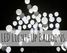 the words led light - up balloons are in front of a black and white background