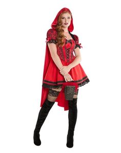 a woman dressed in a red riding outfit