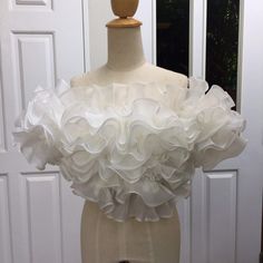 "Claire white off the shoulder ruffle top -If you need this item sooner please send me a message -Made to order -Please check my sizes chart before ordering -If doesn't fit in my size chart please measure your bust and waist -Zipper closure on the back side -Organza fabric -Color:more than 20 colors SGinstar Size Guide UK4/US0/EU32/AU4 Bust 31\"(78cm.) Waist24\"(60cm.) Hips33\"(83.5cm.) UK6/US2/EU34/AU6 Bust32\"(80.5cm.) Waist25\"(63cm.) Hips34\"(86cm.) UK8/US4/EU36/AU8 Bust33\"(83cm.) Waist26\" Zara Ruffle Top White, Bridal Separates Tops, Bridal Separates, White Off Shoulder, Pretty Blouses, Organza Fabric, Easy Trendy Outfits, Ruffle Top, Off Shoulder Tops