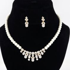 These Beautiful Romantic Swarovski Crystal Modern Geometric Pearl leaves Diamond/Crystal Necklace Set are made of very fine quality of Swarovski crystals for your special day! The material used in these Necklace and earrings set are free from Lead, Nickel, Cadmium so it will not give you any skin irritation and environment friendly too.. MEASUREMENTS :- Necklace measures about 19.5 inches adjustable around your neck.  Earrings measures about 1 inches long 0.4 inches wide. Bracelet width: 0.5 inc Dazzling White Rhinestone Bridal Necklace, White Sparkling Crystal Bridal Necklace, Dazzling White Bridal Necklace With Rhinestones, White Bridal Necklace With Rhinestones, Diamond White Crystal Embellished Necklaces, Diamond White Crystal Necklaces With Elegant Design, White Crystal Pearl Necklace With Rhinestones, White Crystal Rhinestone Necklace For Anniversary, Elegant Crystal Necklaces With Sparkling Stones