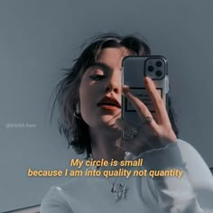 a woman taking a selfie with her cell phone in front of her face and the words my circle is small because i am into quality not quantity