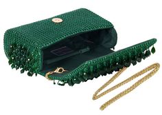 This bejeweled flap over clutch is decadently hand embroidered with an assortment of lustrous semi precious gems, Japanese micro beads & crystals in an ombre pattern. It has an ornate yet elegant look. It comes with a matching hand embellished handle & a long chain, to style it with both modern and traditional outfits. The handle is delicately hand embroidered with lustrous micro beads, crystals and diamanté. The glittering radiance of the crystal tassels, augments the elegant demeanor of this clutch. This handle can also be used with any existing bag. Luxury Formal Bag With Beaded Fringe, Elegant Festive Sequined Clutch, Elegant Beaded Fringe Evening Bag For Formal Occasions, Formal Green Embellished Clutch, Elegant Party Bag With Beaded Fringe, Beaded Fringe Evening Bag, Green Luxury Embellished Clutch, Luxury Green Embellished Clutch, Elegant Green Beaded Evening Bag