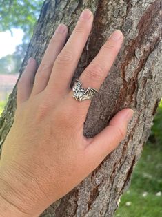 "This solid sterling silver, Bat Flight Ring has a 1 1/4\" wingspan. This unique ring lays flat along the finger making it comfortable and easy to wear. Take flight with one tonight! We have many ring sizes immediately available. We will contact you to let you know if we have your chosen ring size in stock or when to expect shipment. All Marty Magic Jewelry is packaged in a beautiful box embossed with the gold foil Marty Magic dragon logo. Perfect for any occasion! Designed in Santa Cruz Califor Bat Engagement Ring, Unique Silver Rings For Halloween, Bat Ring Jewelry, Bat Necklace, Victorian Bat Jewelry, Vampire Jewelry, Bat Ring, Snake Ears, Halloween Ring