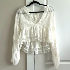 Nwot. White Lace, Cropped Blouse. Long Sleeves, Sheer See-Through Material. Mixed Details: Floral (Bodice), Polka Dots (Bottom Hem), And Lines (Sleeves). Deep V Neck. Never Worn, Recommend For Smaller Chest Women. Lace Long Sleeve Tops For Daywear, Lace Long Sleeve Tops For Day Wear, Lace Top With Long Sleeves For Daytime, Lace Top With Long Sleeves For Daywear, White V-neck Blouse With Lace Top, Lace Long Sleeve Blouse For Brunch, Chic Lace V-neck Tops, Lace Top Long Sleeve For Brunch, Lace V-neck Blouse With Ruffles