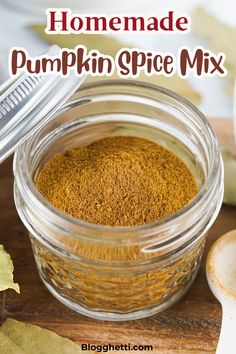 homemade pumpkin spice mix in a glass jar on a wooden table with the title above it