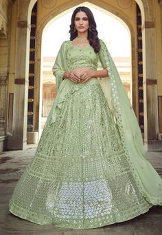 Pista green georgette sequins work lehenga choli 7703  Desc:  Style : Circular Lehenga Choli Color : Pista Green Fabric : Georgette Work : Sequins   Thread Occasion : Festival   Engagement   Ceremonial   Baby Shower   Ganesh Charturthi Wash Care : Dry clean Sleeve Style : Half Sleeve Long Sleeves : Done only in Custom Stitch Sleeves Lining : Done only in Custom Stitch Bust Size: 32 to 42 Inches. With Express Free Shipping and Custom Stitching, Buy Indian Wedding Party Wear lehenga Pista green ge New Lahenga Design, Dholki Dress, Lehenga With Price, Sequins Lehenga Choli, Wedding Bridal Saree, Lehenga Choli For Wedding, Sequins Lehenga, Choli For Wedding, Green Lehenga Choli