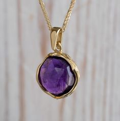 "Unique Purple Amethyst Pendant Necklace, made of 14K Solid Yellow Gold, Round Shaped, Fine Jewelry for Women, Handmade By AditaGold. This beautiful handmade short necklace is made of 14K yellow gold and gorgeous round shaped purple amethyst gemstone. Amethyst is February's birthstone, and this solid gold and amethyst necklace will be perfect for any occasion.  It is classic and elegant and will add a beautiful sparkle to a day or evening look. This necklace is the perfect gift, a meaningful way Amethyst 14k Stamped Jewelry For Gift, 14k Stamped Amethyst Jewelry Gift, Amethyst Jewelry Stamped 14k Gift, Yellow Gold Amethyst Necklace Hallmarked, Yellow Gold Amethyst Birthstone Necklace, Yellow Gold Amethyst Round Pendant Necklace, Spiritual Yellow Gold Amethyst Necklace, Amethyst Necklace With Bezel Setting As Gift, Gift Amethyst Necklace With Bezel Setting