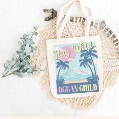 "Life's better at the beach tote, beach day tote, beach bum tote, ocean chid tote ,gift Perfect tote to carry all you must haves! DETAILS: 13.5\" x 13.5\" x 4\" Polyester US CURRENT PROCESSING TIME Please allow 2-7 business days for your item to be created, this does not include shipping, holidays, or weekends. Each item is made to order for each customer. Making products on demand instead of in bulk helps reduce overproduction. CARE INSTRUCTIONS -Machine wash cold, inside-out, gentle cycle with similar colors recommended. -Tumble dry low, or hang-dry for longest life. -Do not iron directly on or near decoration. -Do not dry clean. IMPORTANT NOTE I try to depict all tote and design colors as close to the original as possible but depending on your screen settings or the shirt color you chos Cute Blue Bags For Vacation, Fun White Beach Bag For Vacation, Cute Blue Beach Bag, Casual Beach Bag For Gift, Fun Beach Bag For Beach Season, Casual Beach Bag For Beach Season Gift, Playful White Beach Bag, Playful White Beach Bags, Summer Blue Beach Bag As Gift