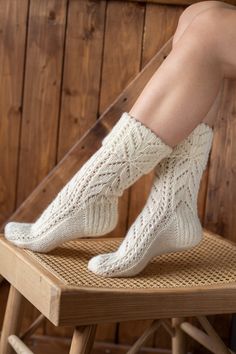 "Hand knitted white socks are inspired by minimalist Scandinavian style. Nordic ornaments, organic wool will keep your feet nice & warm. Natural wool yarns socks designed to be worn with shoes and boots. Ideal to wear during active outdoor time while walking, hiking. Durability Ideal for chilly autumn, winter weather. Hand knitted of 100% natural sheep wool. +𝑨𝒅𝒅𝒊𝒕𝒊𝒐𝒏𝒂𝒍𝒍𝒚 𝑰 𝒂𝒎 𝒂𝒅𝒅𝒊𝒏𝒈 𝒍𝒊𝒏𝒆𝒏 𝒃𝒂𝒈 𝒇𝒐𝒓 𝒑𝒓𝒐𝒕𝒆𝒄𝒕𝒊𝒏𝒈 𝒘𝒉𝒊𝒍𝒆 𝒊𝒕 𝒊𝒔 \"𝒓𝒆𝒔𝒕𝒊𝒏𝒈\" 𝒇𝒐𝒓 Long Knitted Socks, Comfortable Warm White Knee-high Socks, Comfortable Knitted White Socks, White Knitted Socks For Winter, White Knitted Winter Socks, Comfortable White Knitted Socks, Cozy White Knee-high Comfortable Socks, Comfortable Knitted Cream Socks, Comfortable Cream Knitted Socks