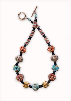 Beaded Necklace - Glass beads in rich tones of terra cotta, sand, and turquoise are individually hand woven around acrylic orbs that echo clusters of woven Czech glass teardrops. Blackstone beads create an elegant frame for this lightweight necklace. <br><br>An antiqued bronze toggle clasp completes the flattering 19 length. Artisan Teardrop Beaded Necklace, Multicolor Teardrop Gemstone Beaded Necklaces, Multicolor Teardrop Jewelry With Spacer Beads, Orb Necklace, Beaded Beads, Long Necklaces, Elegant Frame, Necklaces Jewelry, Bead Jewelry