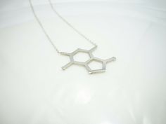 ✔️The most unique jewelry you can find, a perfect gift for you and your loved one. CHOCOLATE MOLECULE STERLING SILVER CHARM NECKLACE, CHEMISTRY SCIENCE JEWELRY Our international customers, please share your phone number and email address for required customs clearance. PRODUCT OVERVIEW Chocolate Molecule Necklace is made of Solid 925k sterling silver. Hypoallergenic jewelry High-Quality polishing and finishing  It fits 16.9 to 18.9 inches, Adjustable  SIZE: The molecule pendant is approximately Molecule Necklace, Sterling Silver Charm Necklace, Silver Charm Necklace, Science Jewelry, Custom Jewelry Box, Charm Necklace Silver, Hypoallergenic Jewelry, Customs Clearance, Sterling Silver Charm