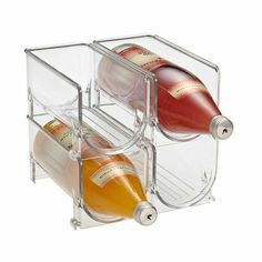 two bottles of wine in a clear holder