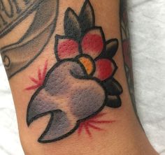 a tattoo with a bird on it's arm