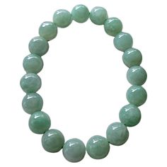 Imperial Japanese Green Burmese A-Jade Jadeite Beaded Bracelet (MADE IN JAPAN) (10.5mm Each x 19 beads) 05013 with calibrated ball beads. 10.5mm each, 19 perfectly calibrated Green Burmese Jadeite Beads. This unique beads bracelet is 100% cut, calibrated, strung, and MADE IN JAPAN. Some of the rarest naturally occurring hues of A-Jadeite, calibrated Green creates a visually stunning Bracelet. With vibrant optics and translucency, the depth of each stone shines. This bracelet has light and darker Modern Bangle, Modern Bracelets, Jade Stone, Jade Beads, Stone Cuts, Beads Bracelet, Burmese, Modern Jewelry, Green And Purple