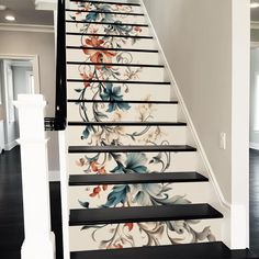 a stair case painted with flowers on it