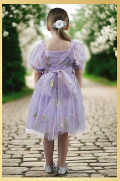 Girls Lavender Floral Dress Discover the captivating allure of our fairy collection featuring an enchanted floral embroidery design in a soft tulle. Perfect for a spring wedding for your flower girl or any special occasion. Combine the charm of the summer season and a light design of the dress that adds a magical charm leaving everyone spellbound. This dress is so soft and light your child will love wearing it. Available in so many colors it will be hard to choose just one. Dress Features The dr Pastel Flower Girl Dresses, Lavender Floral Dress, Lavender Flower Girl Dress, Matching Sister Outfits, Pale Yellow Dresses, Fairy Collection, Purple Flower Girls, Pastel Bridesmaids, Girls Floral Dress