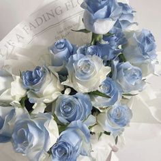 a bouquet of blue and white roses