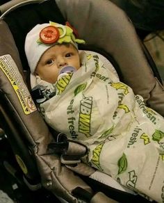 a baby in a car seat with a blanket on it's head and the caption says, best halloween costume ever?