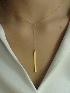 For Ready-to-ship items search here, https://etsy.me/39BDvMS Dainty Bar Necklace / Skinny Vertical Bar / Silver Gold plated Necklace / Simple Everyday Necklace / Bridesmaids Gift About Features- * Made to order * Materials: 925 Sterling Silver * Gold color: Yellow Gold Plating, White Gold Plating, and Rose Gold Plating * Bar dimensions: 36mm long x 3mm wide * Layaway Plan Available * SKU: N173 As a reference, I've included the widths of coins for your visual reference: Dime = 1.25mm Penny = 1.4m Yellow Gold Rectangular Pendant Necklace For Wedding, Gold Bar Necklace With Adjustable Chain For Formal Events, Minimalist Necklace With Adjustable Length For Gift, Minimalist Dangle Necklaces For Parties, Gold Sterling Silver Lariat Necklace For Anniversary, Elegant Engraved Chain Necklace Gift, Gold Lariat Pendant Necklace For Wedding, Gold Rectangular Pendant Jewelry For Wedding, Gold Pendant Lariat Necklace For Wedding