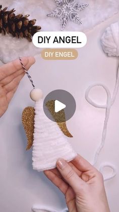 someone is making an angel ornament out of felt and yarn with the words diy angel on it