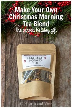 a bag of christmas tea sitting on top of a wooden table with the words make your own christmas morning tea blend