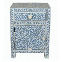 an ornate blue and white cabinet with drawers