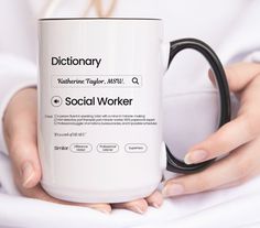 a woman holding a coffee mug with the words dictionary on it